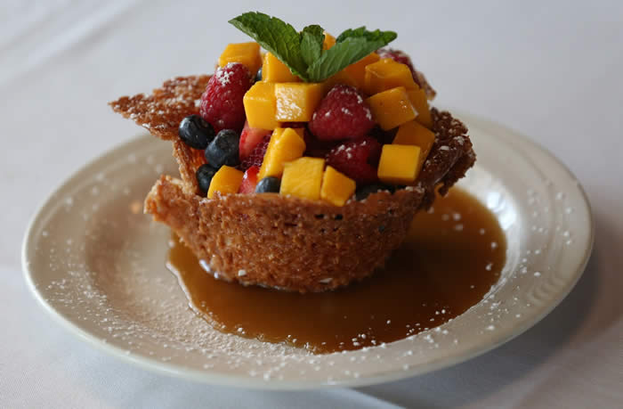 Hutch's almond-laced cookie cup with fresh fruit, whipped cream and caramel sauce.  (Sharon Cantillon/Buffalo News)